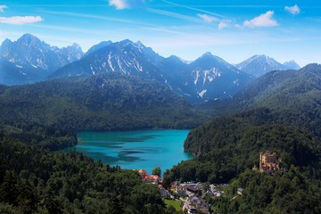 Naklejka na ściany i meble Mountain view village green lake blue sky Germany 