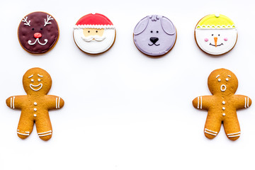 New Year Eve's recipes. Gingerbread cookies with confictionery glaze on white background top view copyspace
