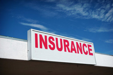 aged and worn insurance sign