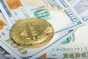 Bitcoin golden coin New virtual money and dollar background . Cryptocurrency. Business and Trading concept. Close-up shot