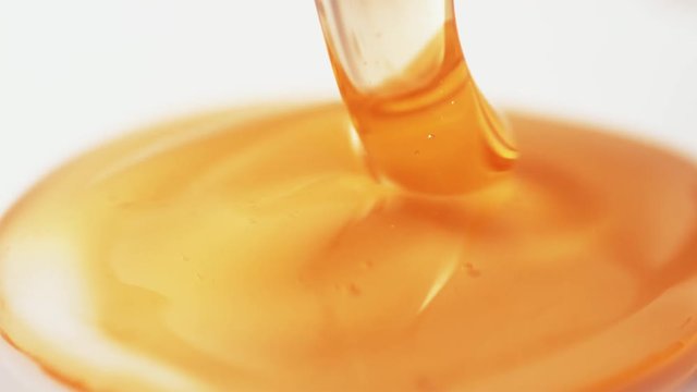 Thick honey dripping.  Shot with high speed camera, phantom flex 4K. Slow Motion.