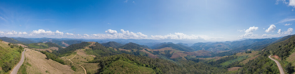 Fototapeta premium Aerial top view photo from flying drone of the Buddhist temple and fields in the countryside of Chiang Mai, Northern Thailand
