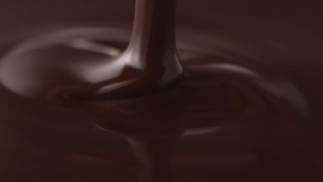 Pouring melted chocolate.  Shot with high speed camera, phantom flex 4K. Slow Motion.
