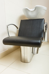 Chair with bowl in hairdresser salon