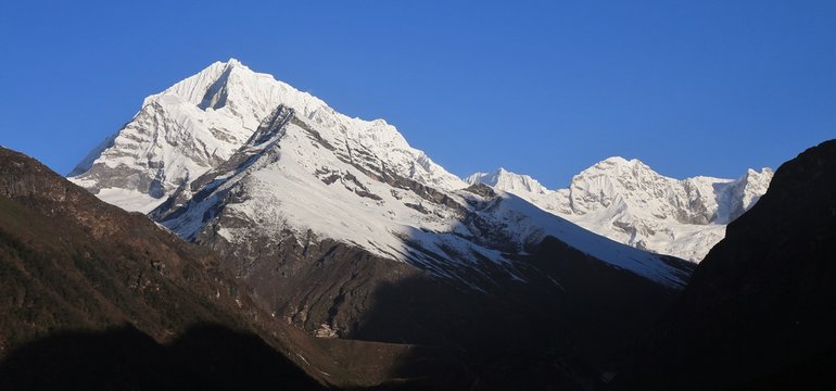 Snow capped Sunder Peak and other high mountains in Nepal. View from a place near Namche Bazaar.