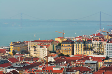 Fototapeta na wymiar Lisbon from above: view of Baixa district and Rio Tejo (River Tagus) from Castelo de Sao Jorge