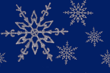 silvery snowflake on a blue background