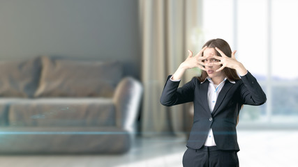 Young beautiful business woman and creative designer standing over blured interior background