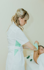 Sugaring. The girl beautician deals in the customer's hands sugar wax.