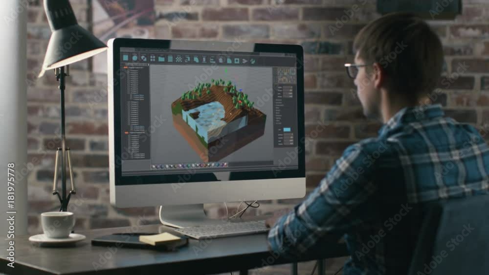 Poster Video Game Designer Works on a New 3D Level on His Personal Computer. He Works as a Developer in a Creative Office Environment.