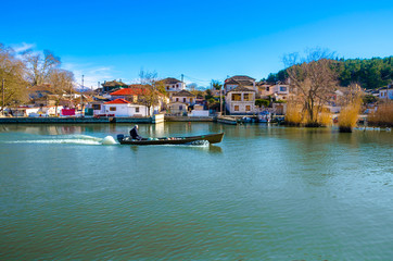 Obraz premium The pictursque waterfront of the island of kyra Frosini Nissaki at the lake Pamvotida, Ioannina, Greece.