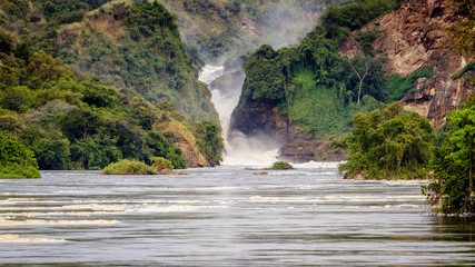 The bottom of the Murchison Falls waterfall reached by a safari boat tour in the national park. Too...