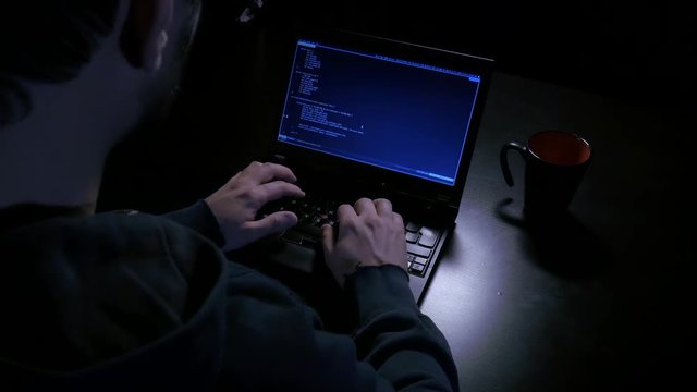 Overhead shot of hacker typing
