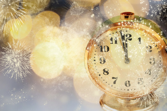 old clock at twelve o'cklock on holiday fireworks background - New Year's