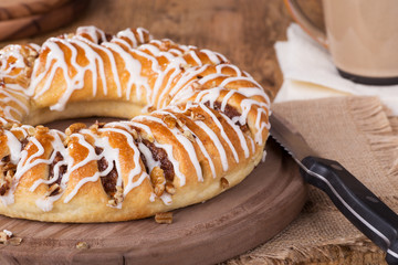 Whole Cinnamon Pecan Danish on a Wooden Platter