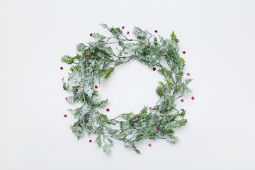 Christmas wreath, holly and red berries, flat lay
