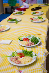 children learn to cook spaghetti in school cooks for small children