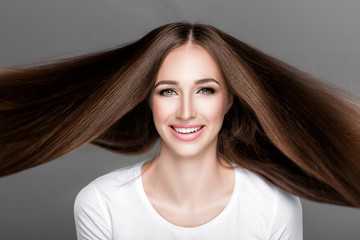 Naklejka premium woman with shiny straight long hair. 