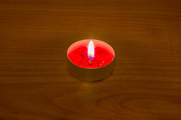 Burning red aromatic candle.