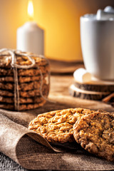 Winter autumn still life  homemade recipe honey ginger oatmeal cookie and bagel, cocoa cup coffee with marshmallow on wooden table kitchen