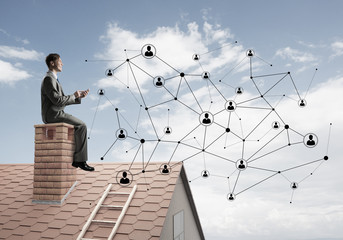 Businessman or student on brick roof and concept of social connection