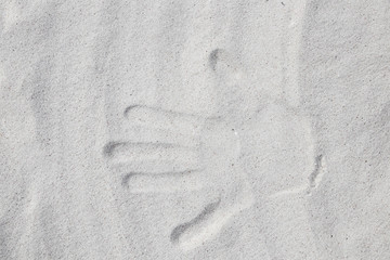 Handprint on the sand