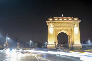 Fototapeta na wymiar The Arc of Triumf in Bucharest, Romania, seen at night 