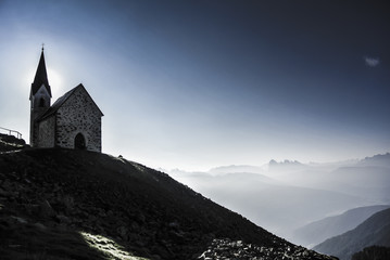 The chapel at the Latzfonser Kreuz at sunrise with a view on Dololmtes