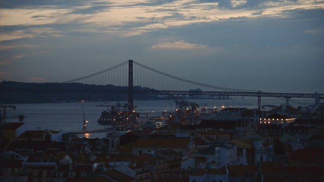 Bridge of 25th april in Lisbon at evening.