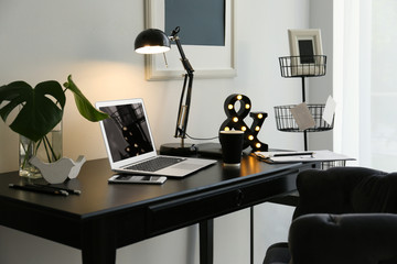 Interior of beautiful modern room with comfortable workplace