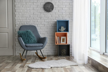 Modern interior with rocking armchair