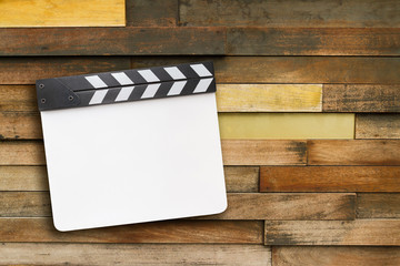 Clapper board on wooden background