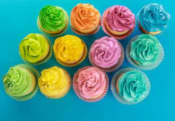 Tasty cupcakes on color background