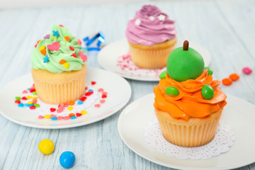 Beautiful cupcakes on wooden table
