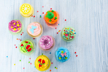 Fototapeta na wymiar Beautiful cupcakes on wooden table