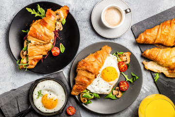 Croissant sandwiches with Fried Egg, Salad Leaves, Grilled Mushr