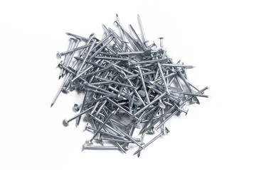 a  pile of metal nails on a white background