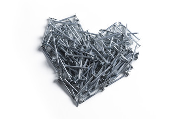 a heart of metal nails on a white background
