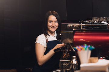 Fototapeta na wymiar Barista working at coffee machine
