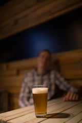 Man in a pub in front of craft beer