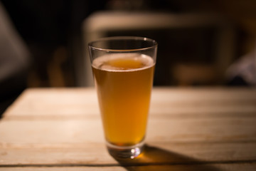 Craft beer on wood table in a pub