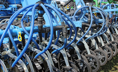 tractor and seeder planting crops on a field