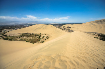 Fototapeta na wymiar Hucachina oasis and sand dunes near Ica, Peru