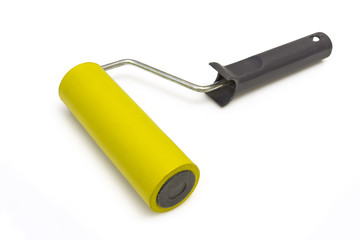 Yellow rubber paint roller on a white background