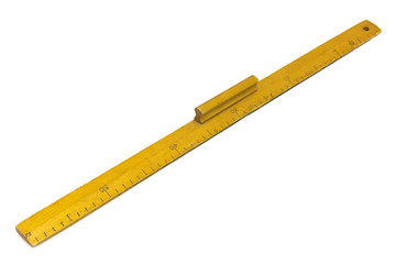 Yellow wooden measuring ruler on a white background