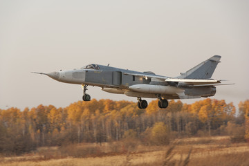 Military jet bomber Su-24 Fencer flying
