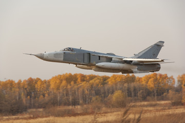 Military jet bomber Su-24 Fencer flying