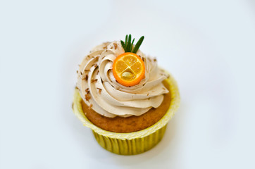 cupcake with cumquat decoration isolated