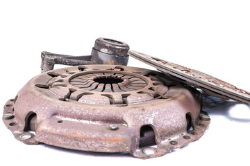 Old used clutch kit on the white background