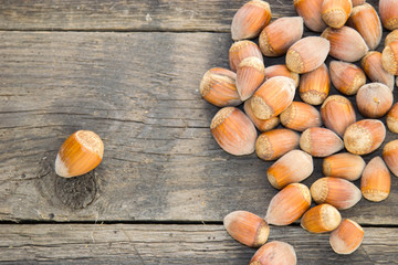 Hazelnuts on a wooden surface